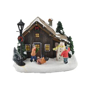 Casetta con bambini e pupazzo di neve